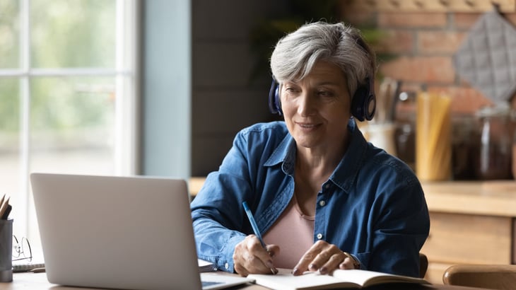 senior woman learning working on laptop