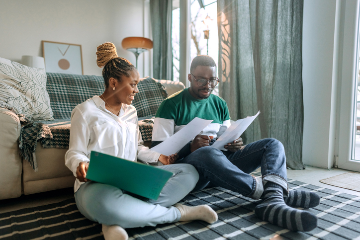 A couple reviewing their retirement plan.