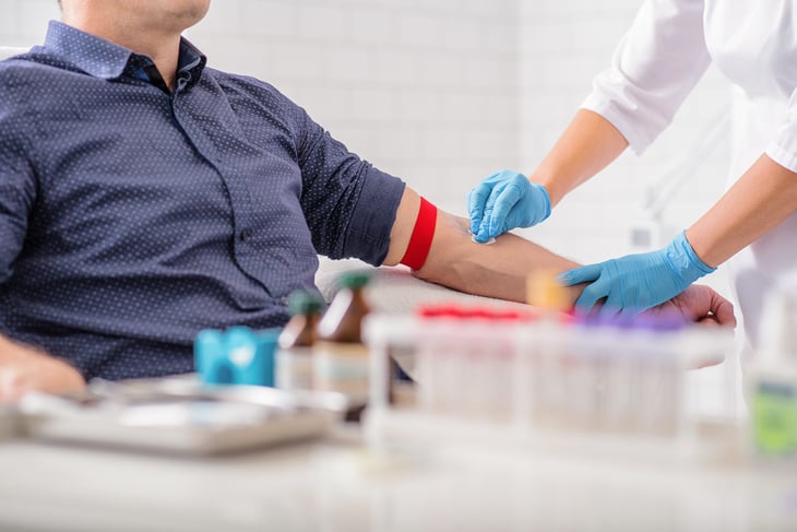 Man getting his blood drawn.